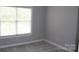 Bedroom with carpeting and window with blinds at 19834 Davidson Concord Rd, Davidson, NC 28036