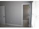 Neutral bedroom with a bright walk-in closet, carpet, and window with blinds at 19834 Davidson Concord Rd, Davidson, NC 28036