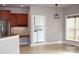 Bright dining room featuring tiled floors and stainless steel appliances in the kitchen at 19834 Davidson Concord Rd, Davidson, NC 28036