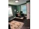 Functional home office with dark hardwood floors, ample natural light, and a clean, organized workspace at 199 Crowell Sw Dr, Concord, NC 28025