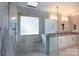 Modern bathroom featuring a glass shower, granite countertops, and updated fixtures with a separate tub at 2031 Brook View Ct, Matthews, NC 28104