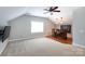 Spacious bonus room with a vaulted ceiling, a wet bar, recessed lights, and a large window at 2031 Brook View Ct, Matthews, NC 28104