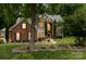 Beautiful two-story brick home with manicured lawn and large windows providing abundant natural light at 2031 Brook View Ct, Matthews, NC 28104