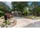 Beautiful brick home with a manicured front yard, landscaped beds, and a long driveway at 2031 Brook View Ct, Matthews, NC 28104