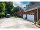 Spacious garage and driveway offer plenty of parking space with an additional gated area at 2031 Brook View Ct, Matthews, NC 28104