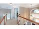 Hallway with hardwood railing overlooking the living area at 2031 Brook View Ct, Matthews, NC 28104