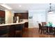 Kitchen with breakfast nook features custom cabinetry, stainless steel appliances and hardwood floors at 2031 Brook View Ct, Matthews, NC 28104