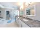 A luxurious main bathroom featuring double sinks, a walk-in shower, and elegant finishes at 2031 Brook View Ct, Matthews, NC 28104