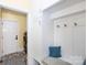 Mudroom with built-in storage, coat hooks, and a bench, perfect for organization near the laundry room at 2031 Brook View Ct, Matthews, NC 28104