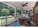 A screened porch offers ample room for entertaining and relaxing, with views of the manicured backyard at 2031 Brook View Ct, Matthews, NC 28104