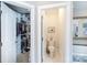 View into the walk-in closet with custom shelving and storage solutions at 2031 Brook View Ct, Matthews, NC 28104