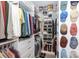 Walk-in closet with custom shelving, drawers, and hanging space for organized storage at 2031 Brook View Ct, Matthews, NC 28104