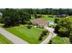 Sprawling property with lush lawn, pool, mature trees, and long driveway, offering privacy and space at 205 Harwell Rd, Mooresville, NC 28117