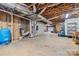 Unfinished basement featuring exposed wooden beams, utilities, and ample storage space at 205 Harwell Rd, Mooresville, NC 28117