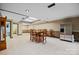Large basement area with a dining table, stainless steel refrigerator, and a retro grandfather clock at 205 Harwell Rd, Mooresville, NC 28117