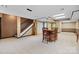 Spacious basement area featuring tile flooring, a staircase, and a classic grandfather clock at 205 Harwell Rd, Mooresville, NC 28117