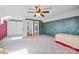 Spacious bedroom featuring a large closet, ensuite bathroom, soft carpet, and natural light at 205 Harwell Rd, Mooresville, NC 28117