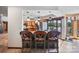 Open-concept kitchen featuring a breakfast bar, stainless steel appliances, and a view to the outdoor patio at 205 Harwell Rd, Mooresville, NC 28117