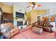 Spacious living room with a stone fireplace, comfortable leather seating, and open access to the kitchen at 205 Harwell Rd, Mooresville, NC 28117