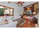 Bright living room with hardwood floors, vaulted ceiling, and staircase access to upper level at 205 Harwell Rd, Mooresville, NC 28117