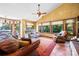 Inviting living room with a fireplace, plush seating, and large windows offering natural light and scenic views at 205 Harwell Rd, Mooresville, NC 28117