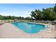 Swimming pool with a diving board surrounded by a white picket fence and lush landscaping at 205 Harwell Rd, Mooresville, NC 28117