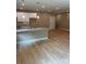 The open-concept kitchen features granite countertops and flows seamlessly into the dining area at 210 Johnson St, Troutman, NC 28116