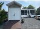 This is an exterior shot, showing the home's extra storage space and porch at 217 Badin View Dr # B257, New London, NC 28127