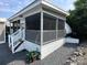 Here is an exterior view showing the screened in porch and gravel landscaping at 217 Badin View Dr # B257, New London, NC 28127