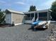 Beautiful exterior of a home with a shed and boats, perfect for outdoor enthusiasts at 217 Badin View Dr # B257, New London, NC 28127