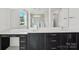 Modern bathroom featuring dual sinks, dark cabinetry, and ample counter space at 220 Windy Dell Dr, Tega Cay, SC 29708