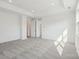 Spacious bedroom with elegant trim, carpet, and natural light streaming through the windows at 220 Windy Dell Dr, Tega Cay, SC 29708