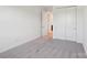 Carpeted bedroom with closet featuring an open doorway and neutral paint at 220 Windy Dell Dr, Tega Cay, SC 29708