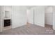 This bedroom has neutral carpet, white walls, a walk-in closet, and an attached bathroom with a dark vanity at 220 Windy Dell Dr, Tega Cay, SC 29708
