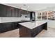 This bright kitchen features an island, stainless steel appliances, and stylish finishes at 220 Windy Dell Dr, Tega Cay, SC 29708
