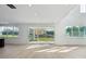 Bright and airy living room with large windows and light wood floors at 220 Windy Dell Dr, Tega Cay, SC 29708