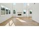 Modern living room with a sleek fireplace and ample natural light at 220 Windy Dell Dr, Tega Cay, SC 29708