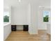Upstairs office space with built-in desk and natural light from two windows, perfect for working from home at 220 Windy Dell Dr, Tega Cay, SC 29708
