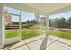This screened porch offers serene views and a seamless blend of indoor-outdoor living at 220 Windy Dell Dr, Tega Cay, SC 29708