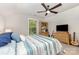 Bright bedroom with a ceiling fan, TV, and hardwood dresser set at 2245 Lincolnshire Ln, Waxhaw, NC 28173