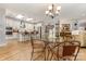 Modern kitchen featuring stainless steel appliances, a large island, and stylish pendant lighting at 2245 Lincolnshire Ln, Waxhaw, NC 28173