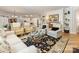 Bright living room with hardwood floors, cozy seating, and stylish decor, perfect for relaxation at 2245 Lincolnshire Ln, Waxhaw, NC 28173