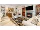 Inviting living room features a fireplace, plush seating, and elegant decor for a comfortable ambiance at 2245 Lincolnshire Ln, Waxhaw, NC 28173