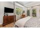 Comfortable bedroom with natural light and a functional layout for relaxation and entertainment at 2245 Lincolnshire Ln, Waxhaw, NC 28173