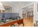 Home office leading to a dining space featuring wood floors and ample lighting at 2245 Lincolnshire Ln, Waxhaw, NC 28173