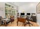 Bright home office with natural light, wood floors, and a comfortable workspace for productivity at 2245 Lincolnshire Ln, Waxhaw, NC 28173