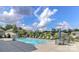 Community pool with lounge chairs and umbrellas, perfect for relaxing on sunny days at 2245 Lincolnshire Ln, Waxhaw, NC 28173