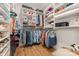 Organized walk-in closet with ample shelving, hanging space, and storage solutions for clothing and accessories at 2245 Lincolnshire Ln, Waxhaw, NC 28173