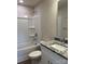 Neat bathroom features a bathtub, tile surround, granite vanity, and modern fixtures at 242 North Ave, Troutman, NC 28166