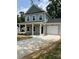 Inviting two-story home boasts a one-car garage and a well-maintained lawn, showcasing its curb appeal at 242 North Ave, Troutman, NC 28166